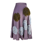 Purple skirt with floral appliqués on a white background