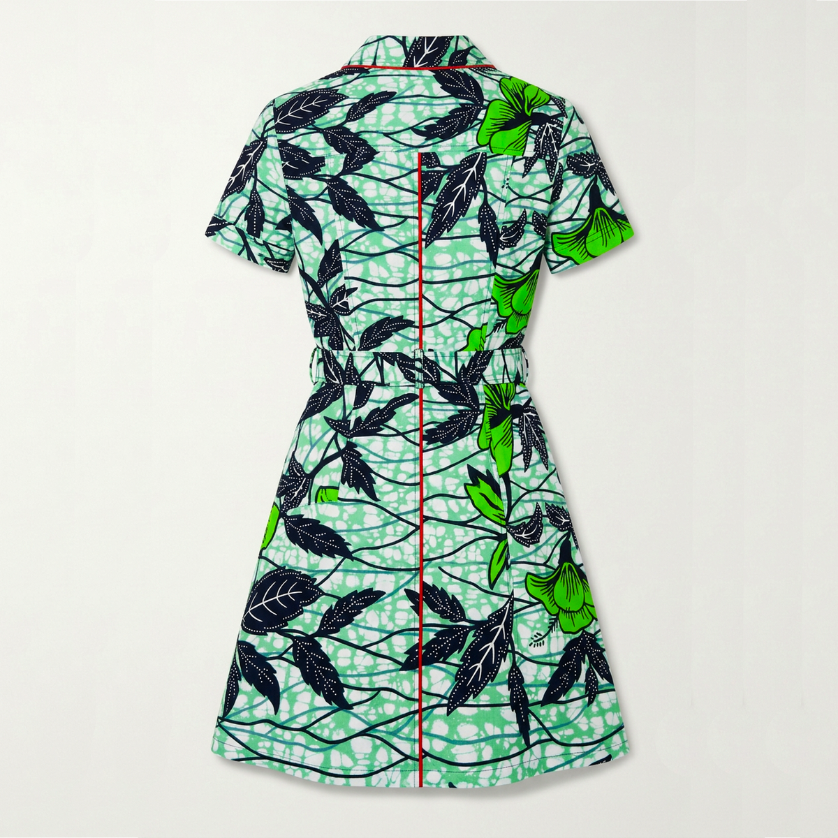 A short-sleeve collared dress shown from the back, featuring a green and white abstract pattern with black leaf motifs and a central red line detail.