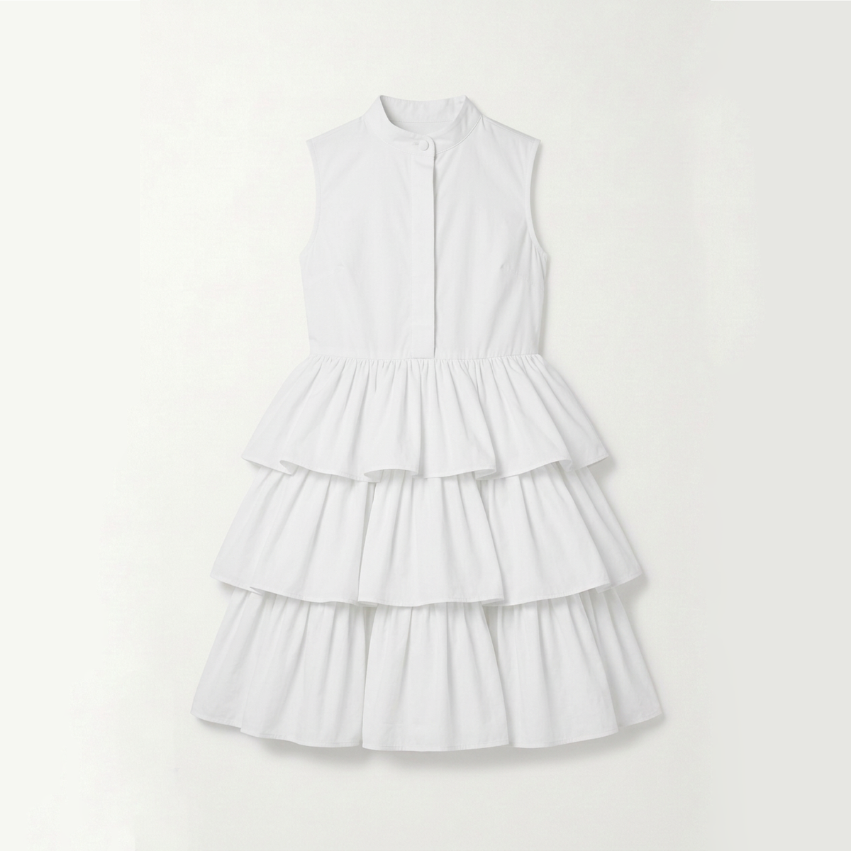 A sleeveless white tiered dress with a high mock neck and button-front bodice, displayed flat against a light off-white background.