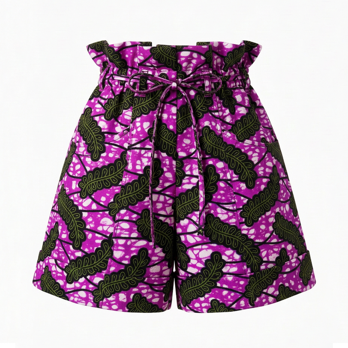 A pair of high-waisted shorts featuring a vibrant magenta and white batik pattern with black leaf motifs, a paperbag waistband, and a matching drawstring tie.