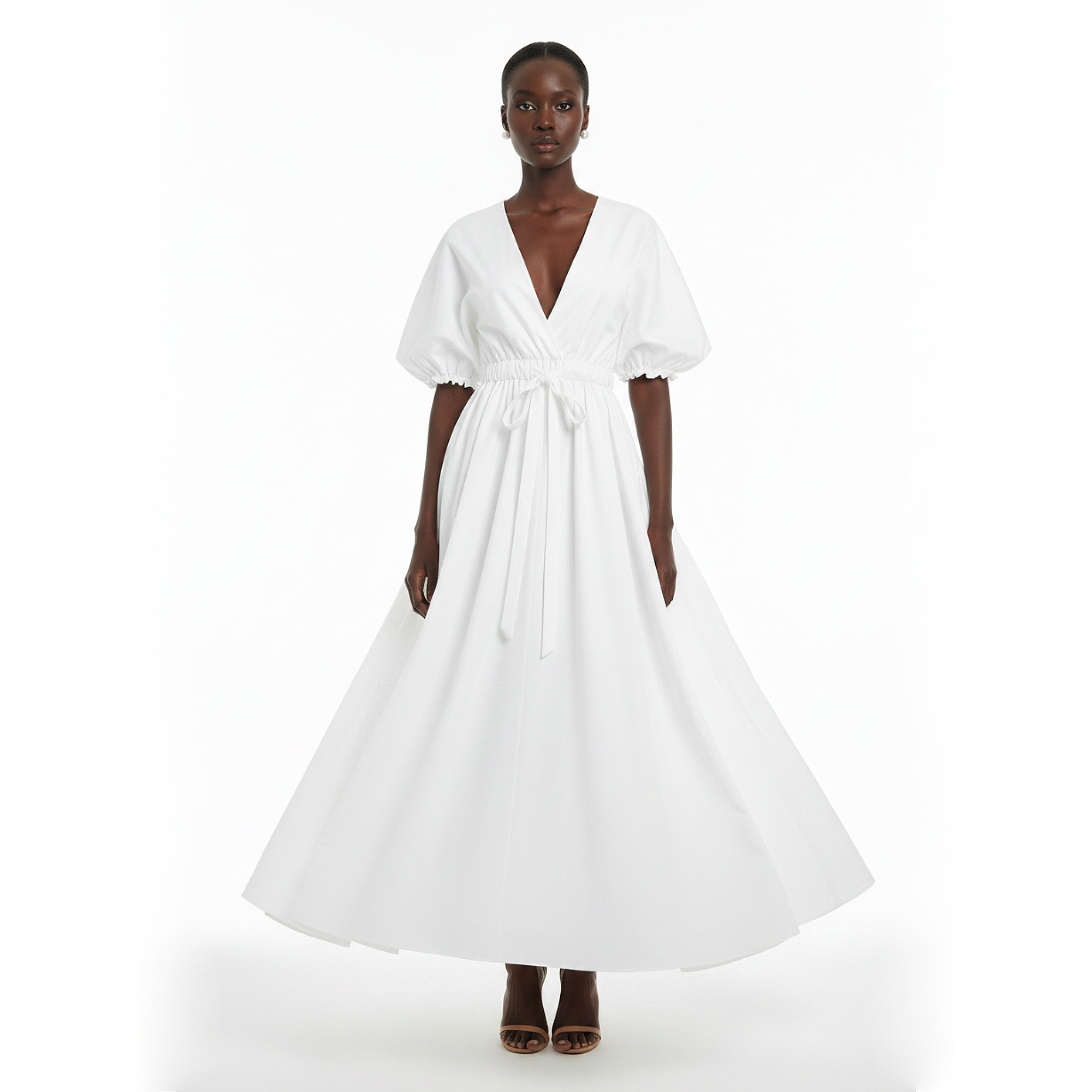 Woman wearing a white dress on a white background
