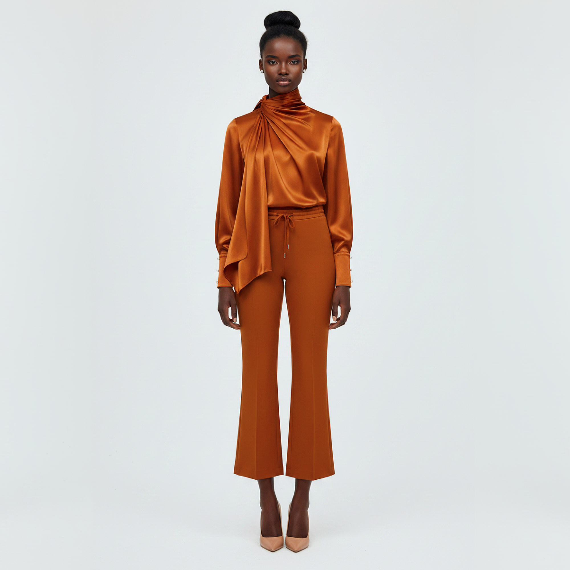 Woman wearing an orange outfit on a white background