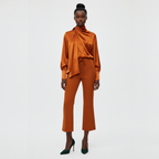 Woman wearing an orange outfit on a white background