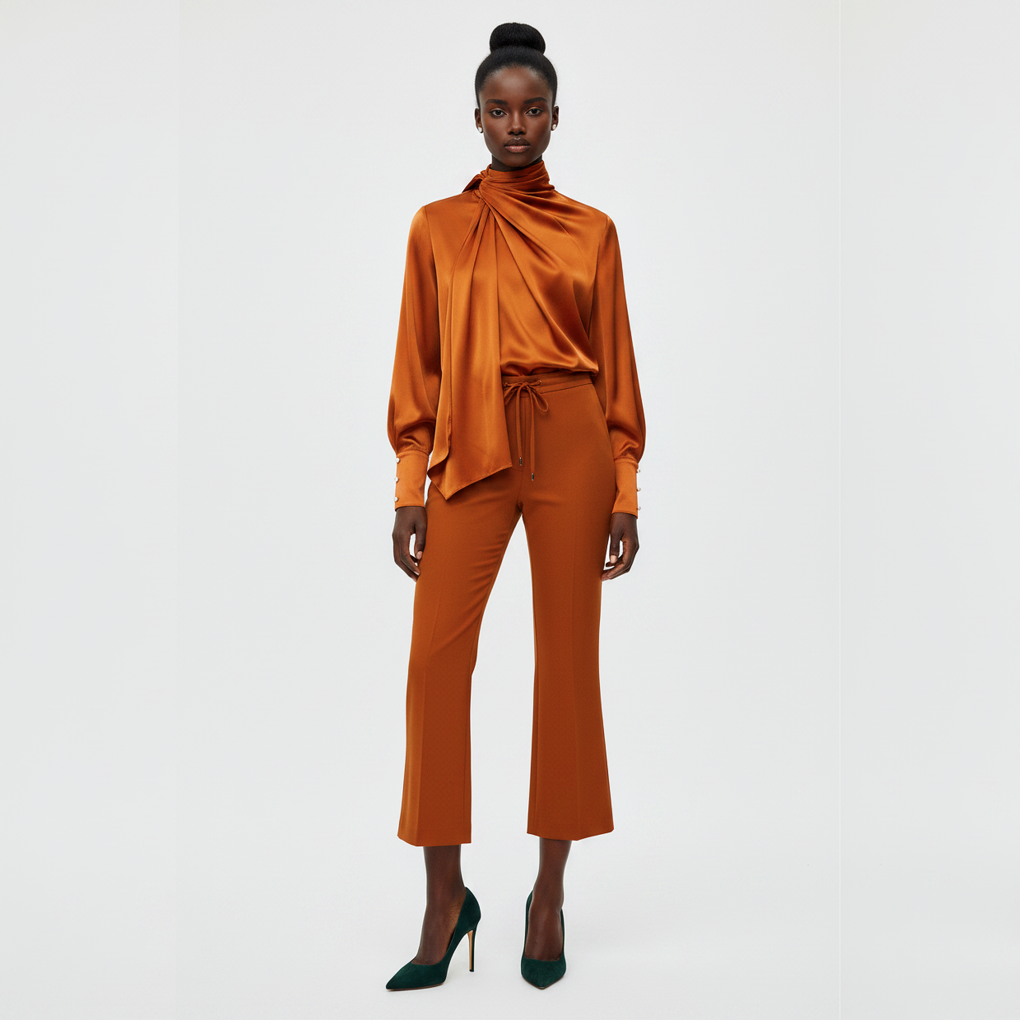 Woman wearing an orange outfit on a white background