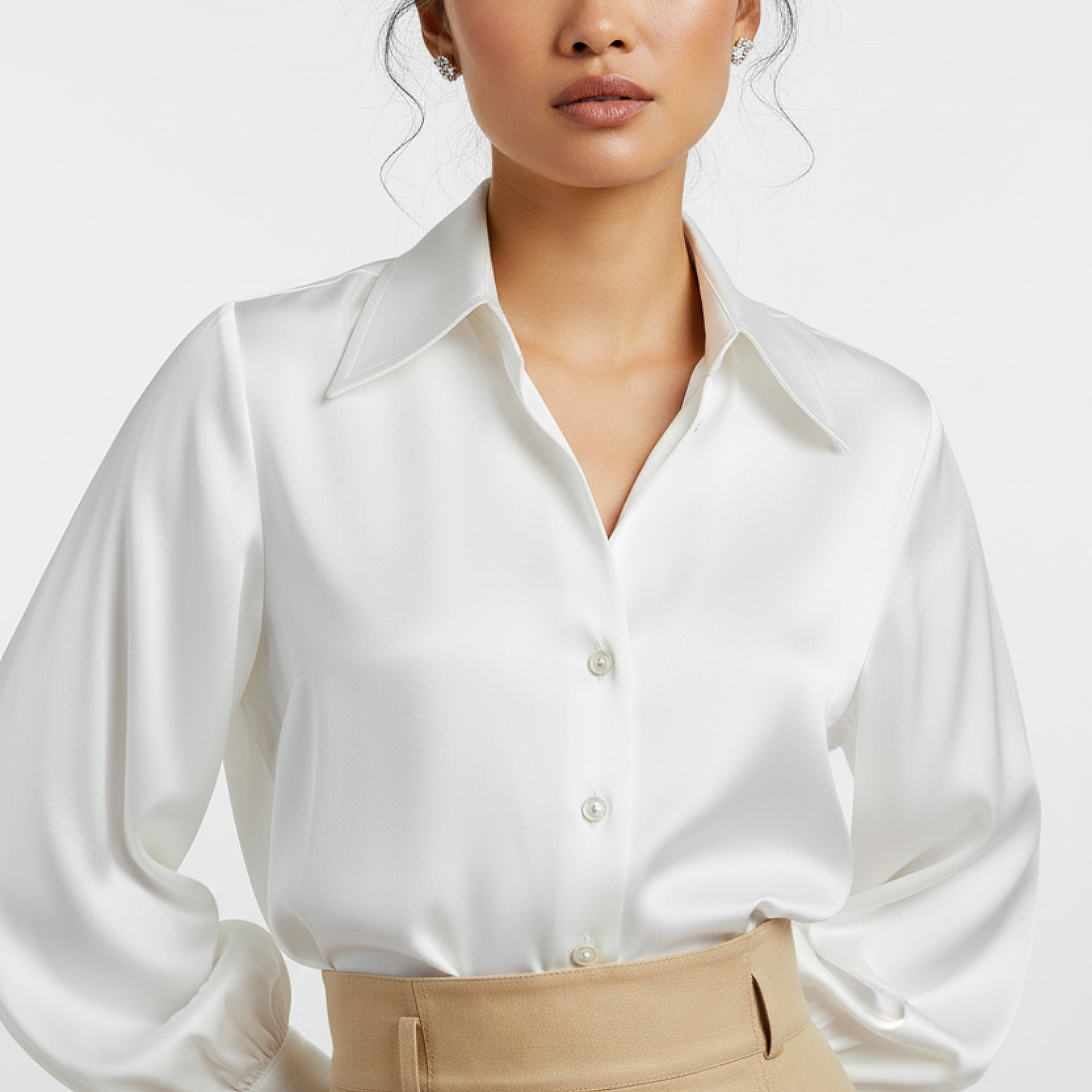 White satin shirt worn by a model on a white background