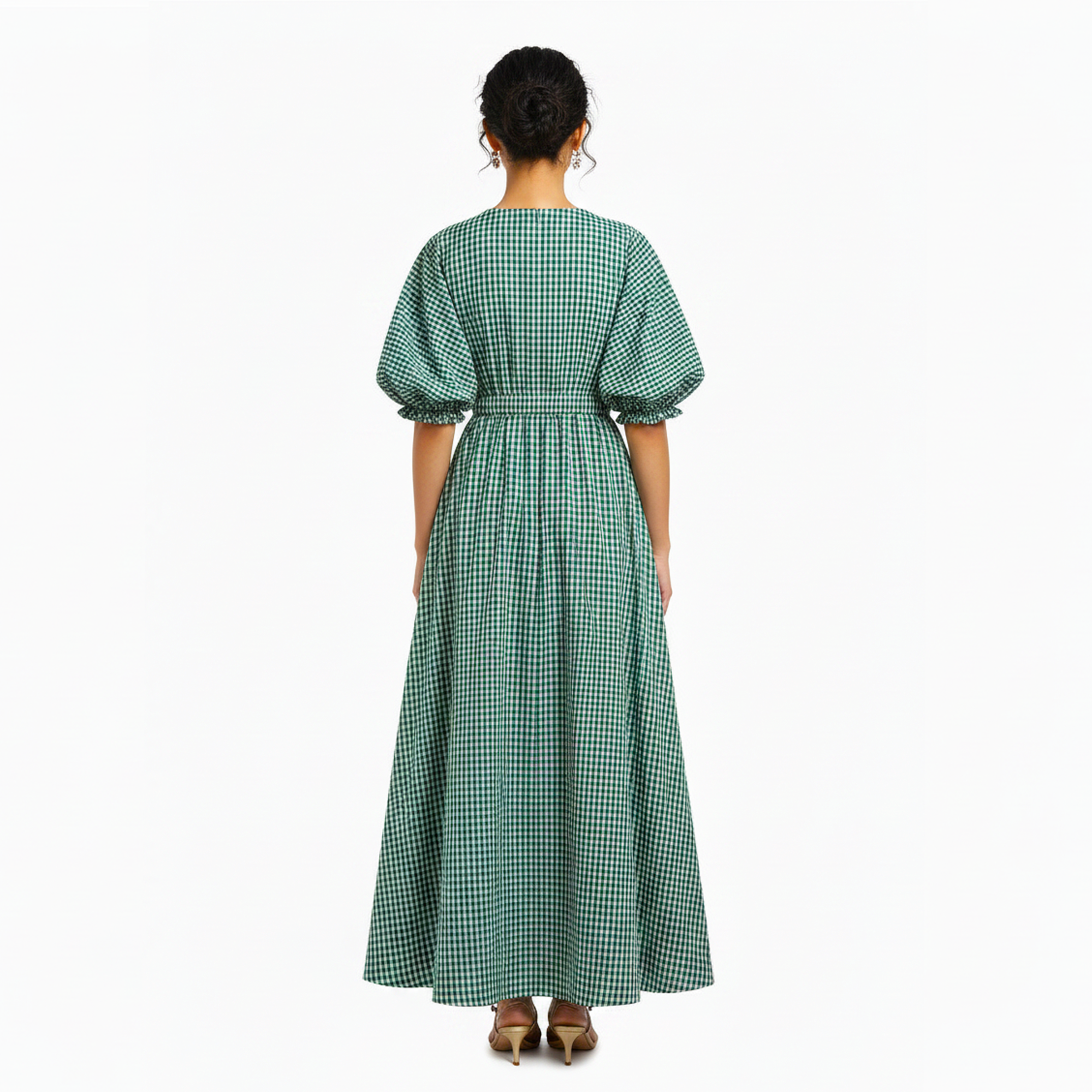 Woman wearing a green checkered dress on a white background