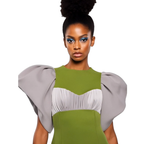 Woman wearing a green and gray dress with puffed sleeves on a white background