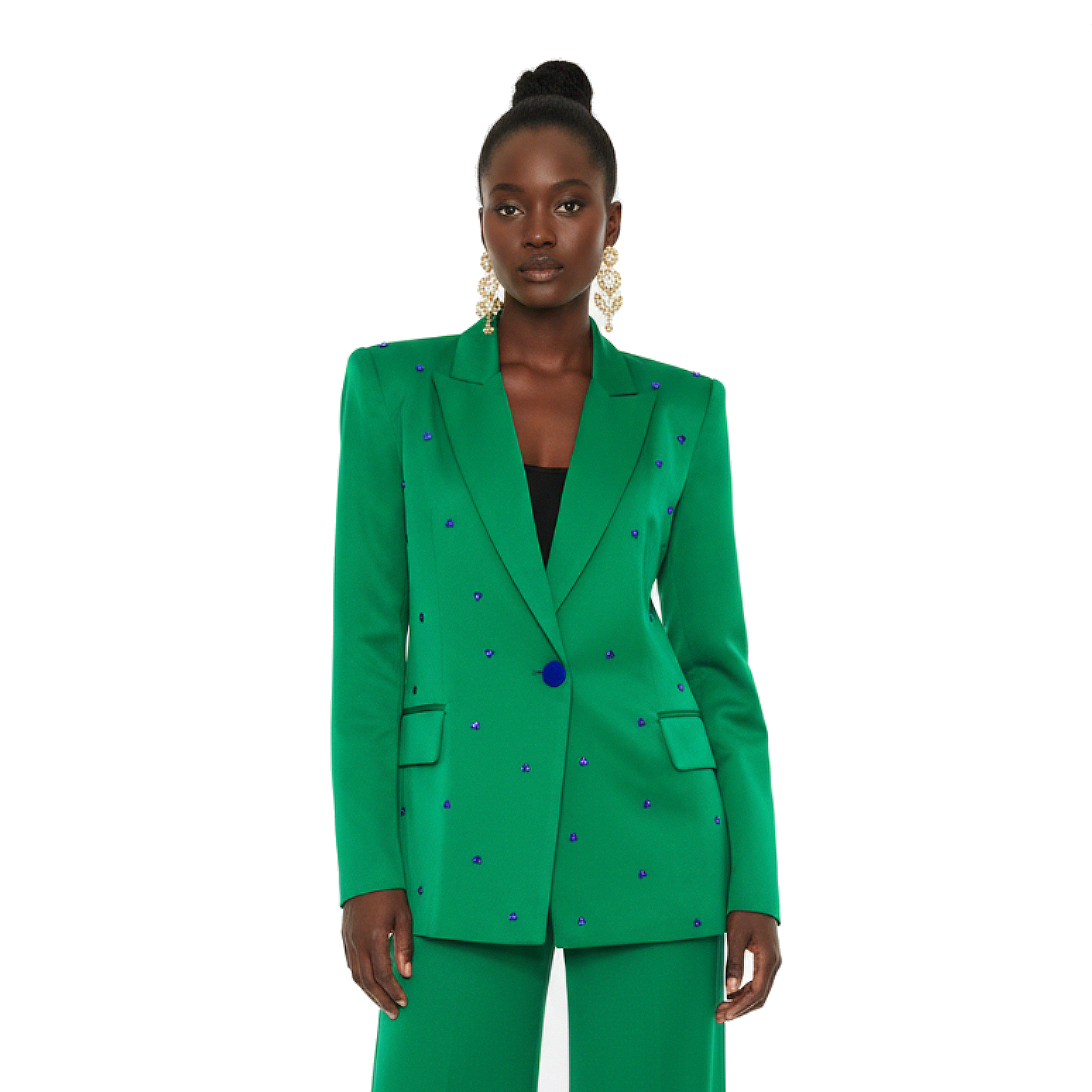 Woman wearing a green suit with blue accents on a white background