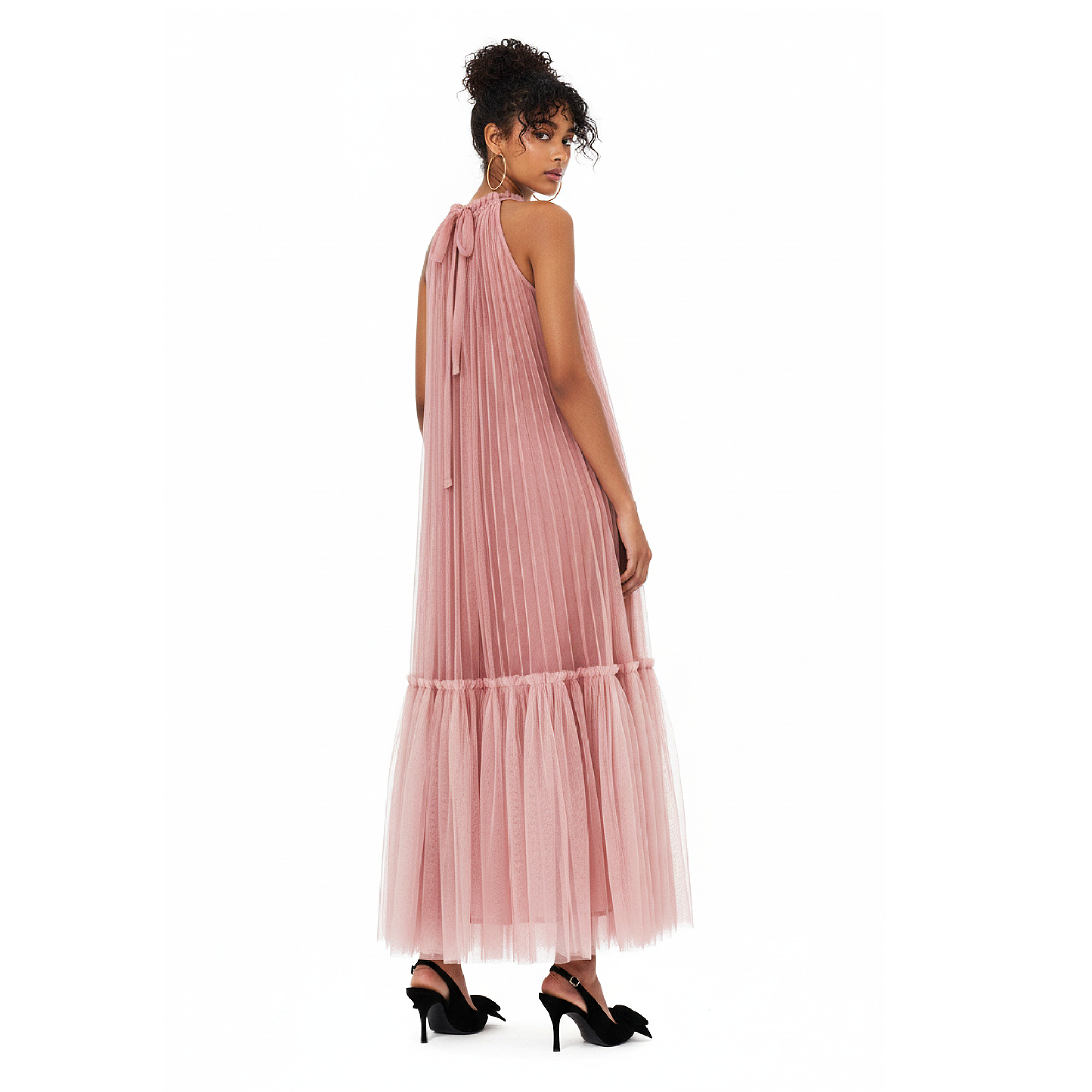 Woman wearing a pink one-shoulder dress on a white background