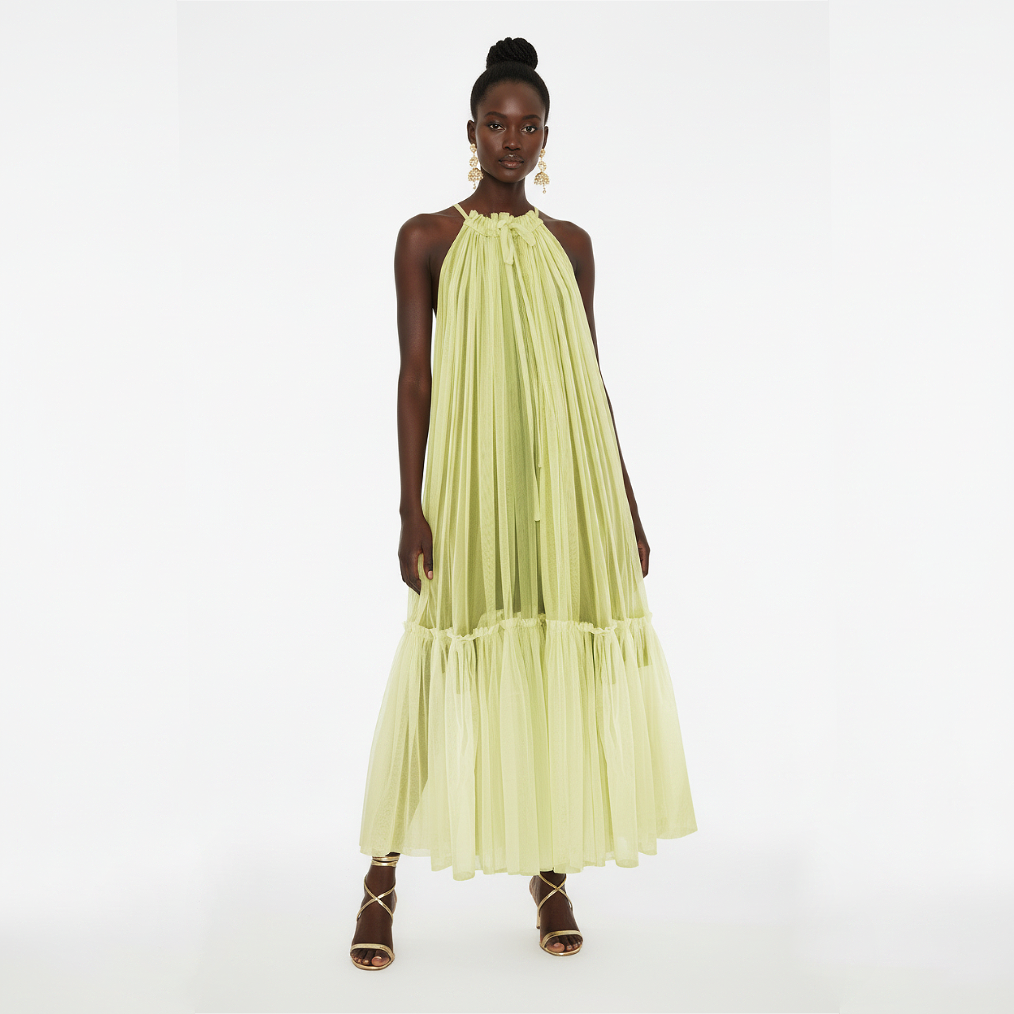 Woman wearing a light green dress on a white background