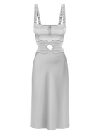 Silver dress with cut-out design on a white background