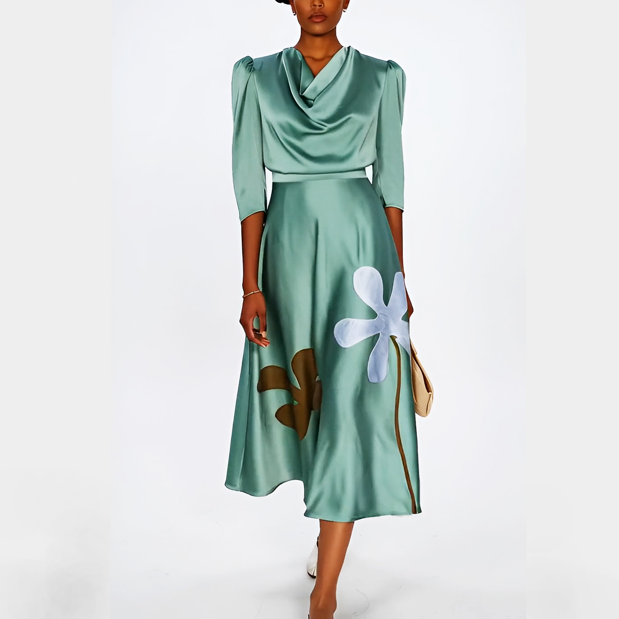 Green dress with floral design on a white background