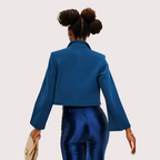 Person wearing a blue outfit with a plain background