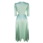 Mint green dress with a subtle gradient on a white background