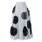 White skirt with black floral patterns on a white background