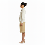 Woman wearing a white blouse and beige skirt on a white background