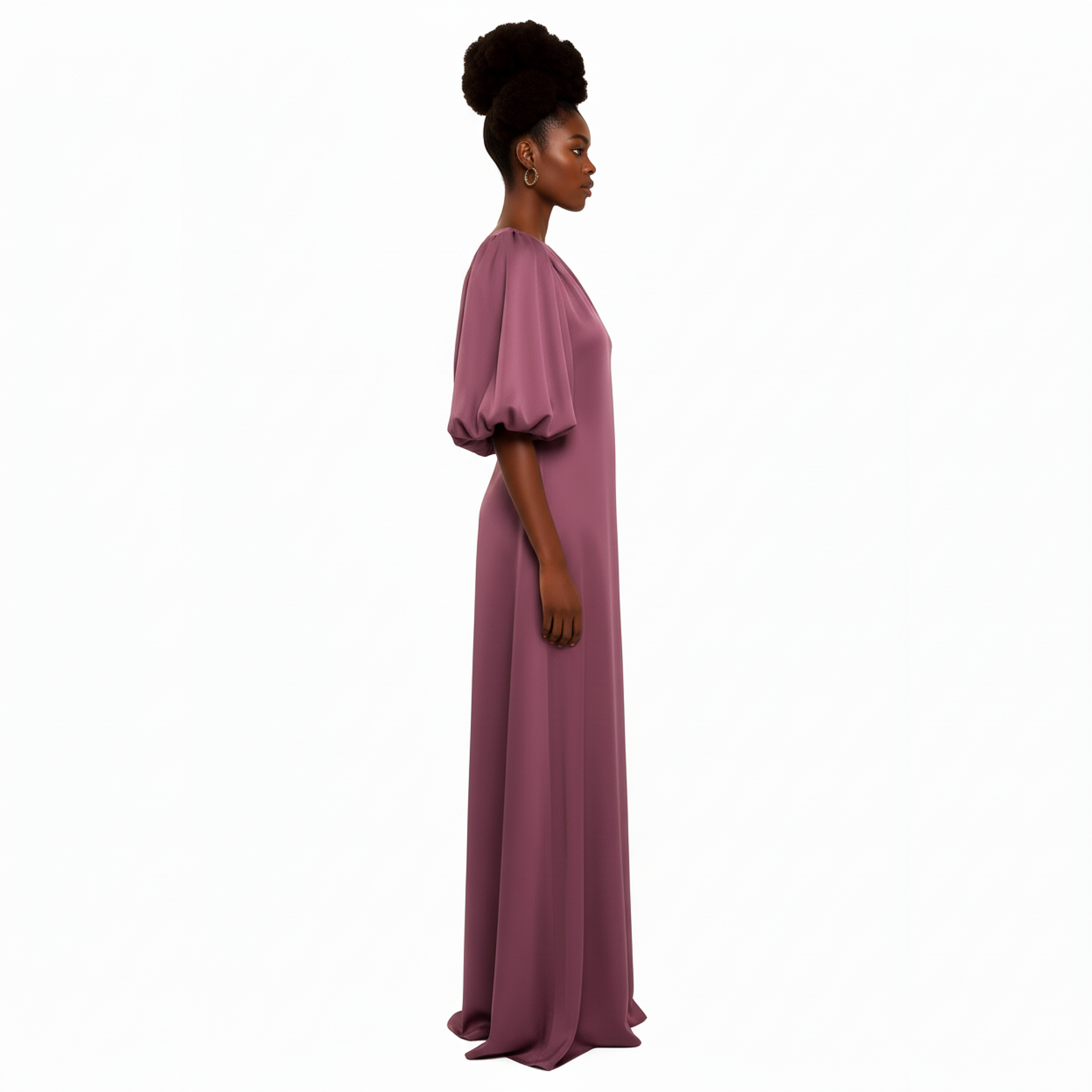 Woman wearing a long, light purple dress on a white background