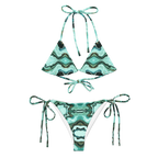 Green and black patterned bikini set on a white background