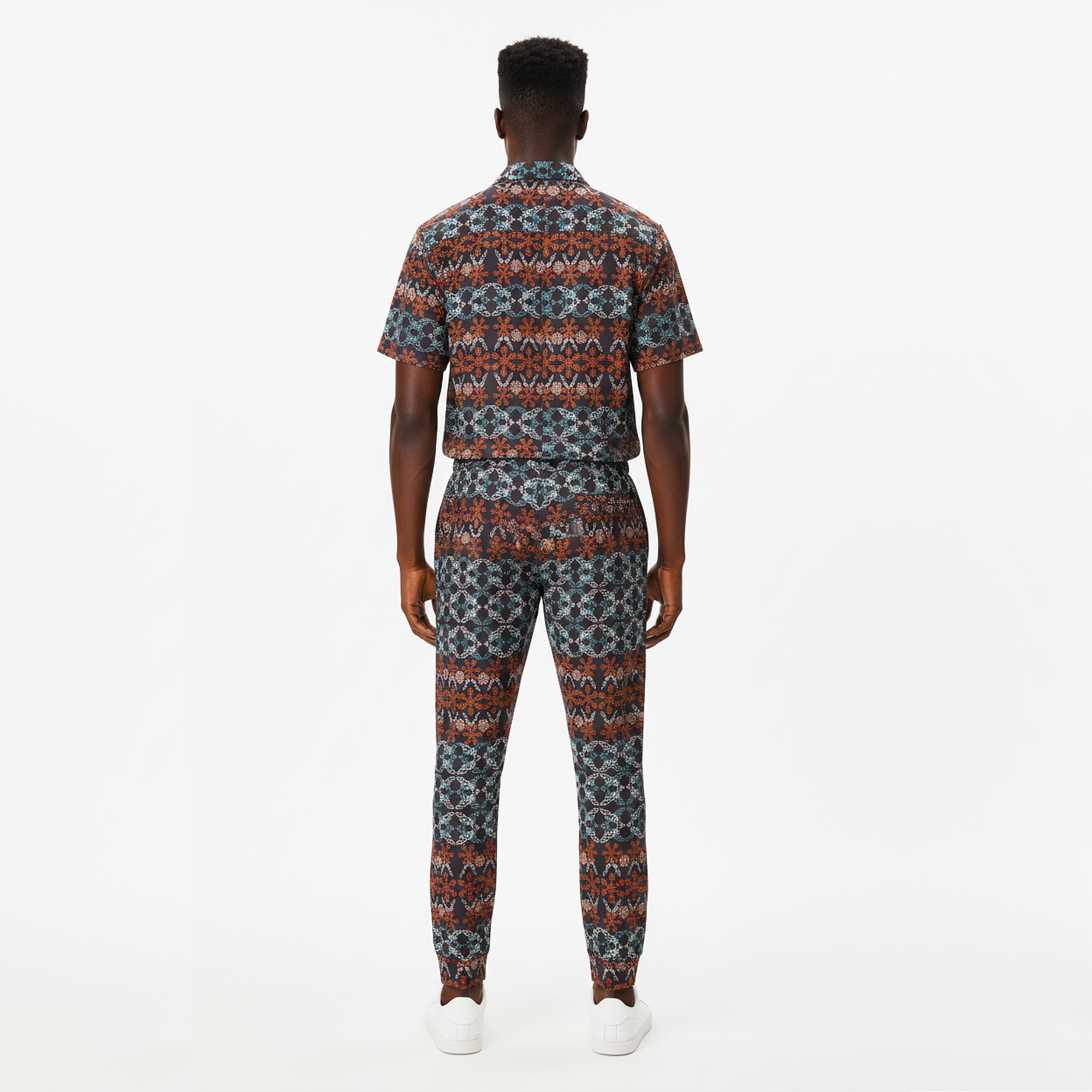 Person wearing a patterned outfit on a white background