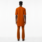 Person wearing an orange outfit on a white background