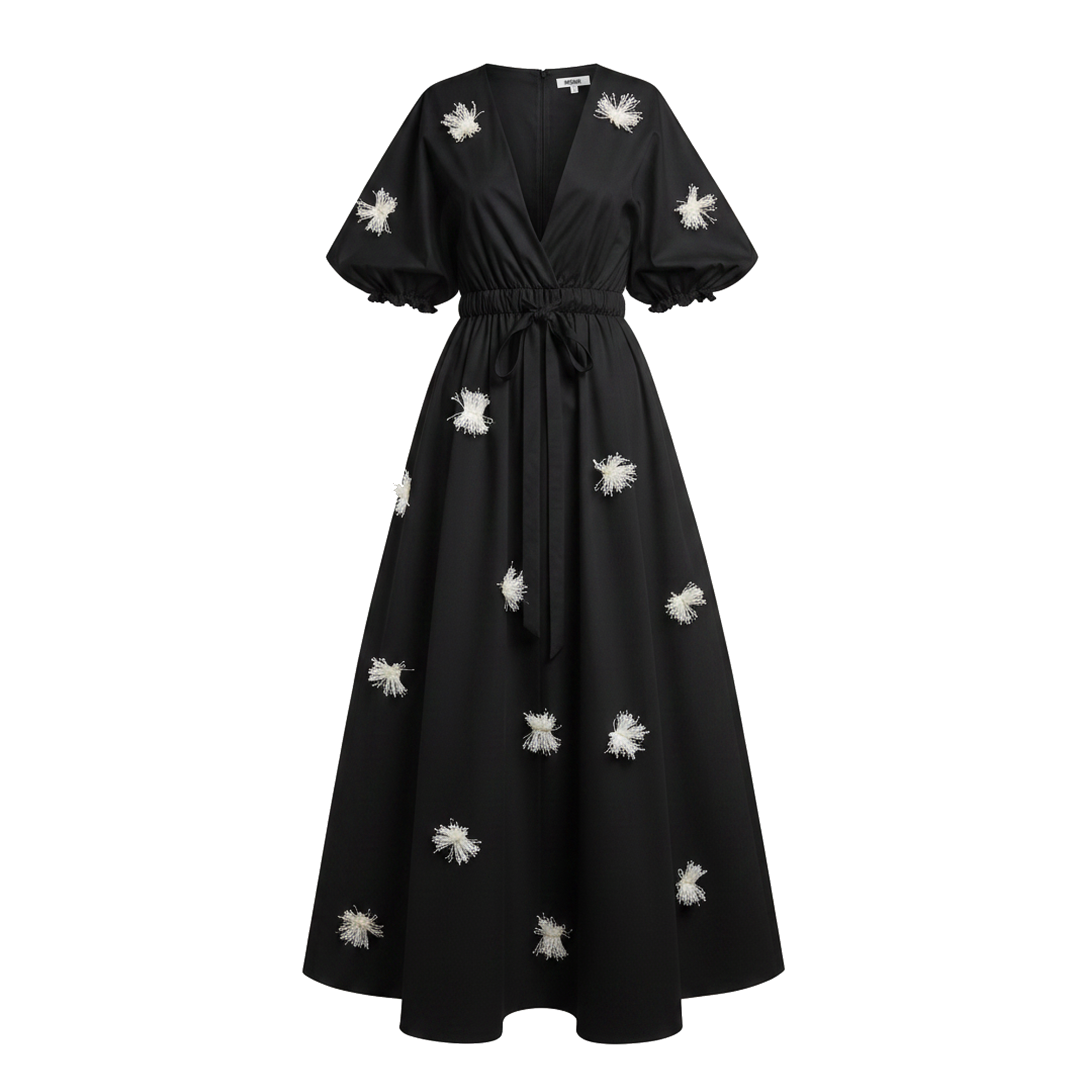 Black dress with white floral embellishments on a white background