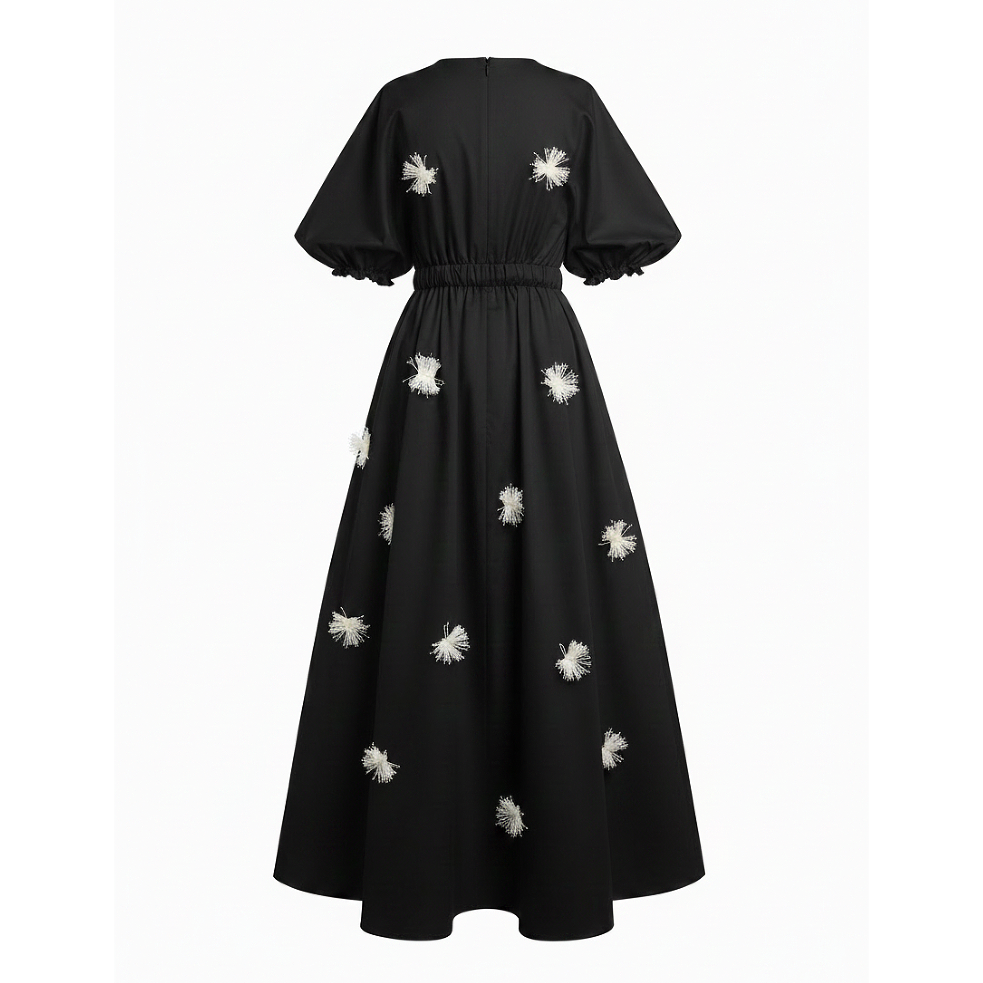 Black dress with white floral embellishments on a white background