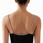 Black dress with sparkling straps on a white background