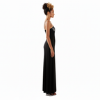 Woman wearing a black evening gown on a white background