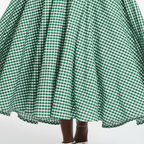 Green and white checkered skirt on a plain background