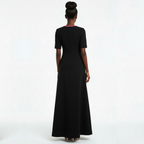 Woman wearing a black dress on a white background