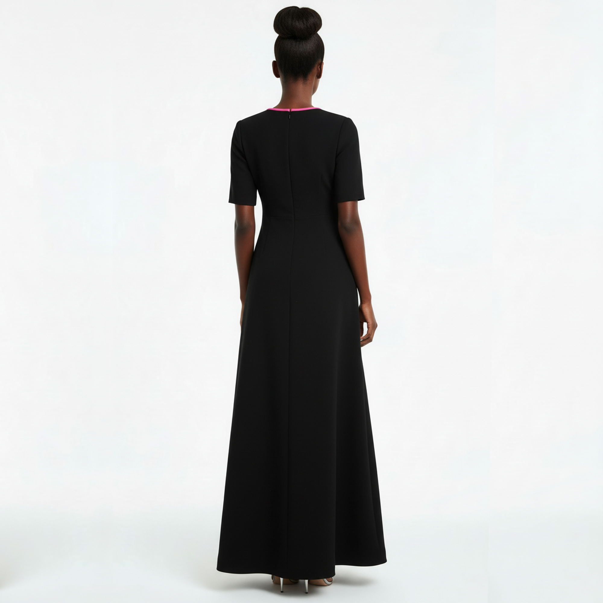 Woman wearing a black dress on a white background