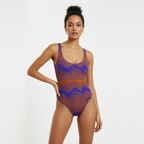 Woman wearing a patterned swimsuit on a white background