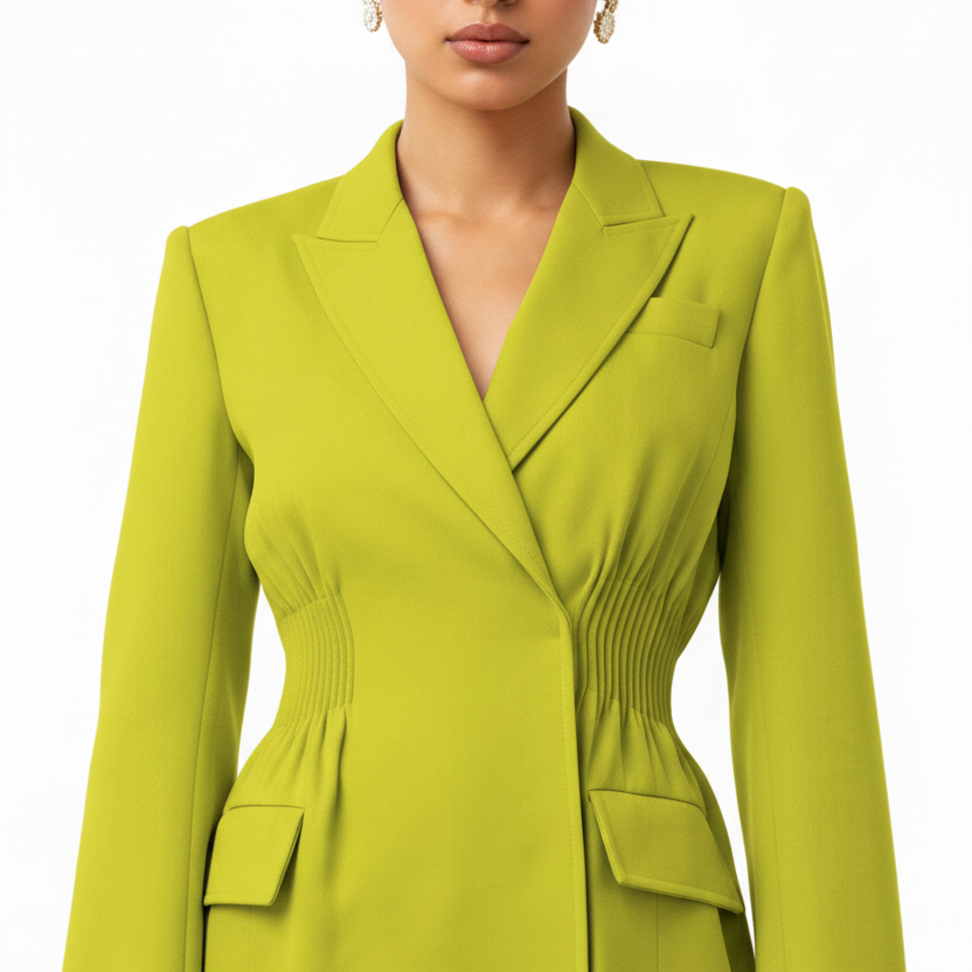 Green blazer worn by a person on a white background
