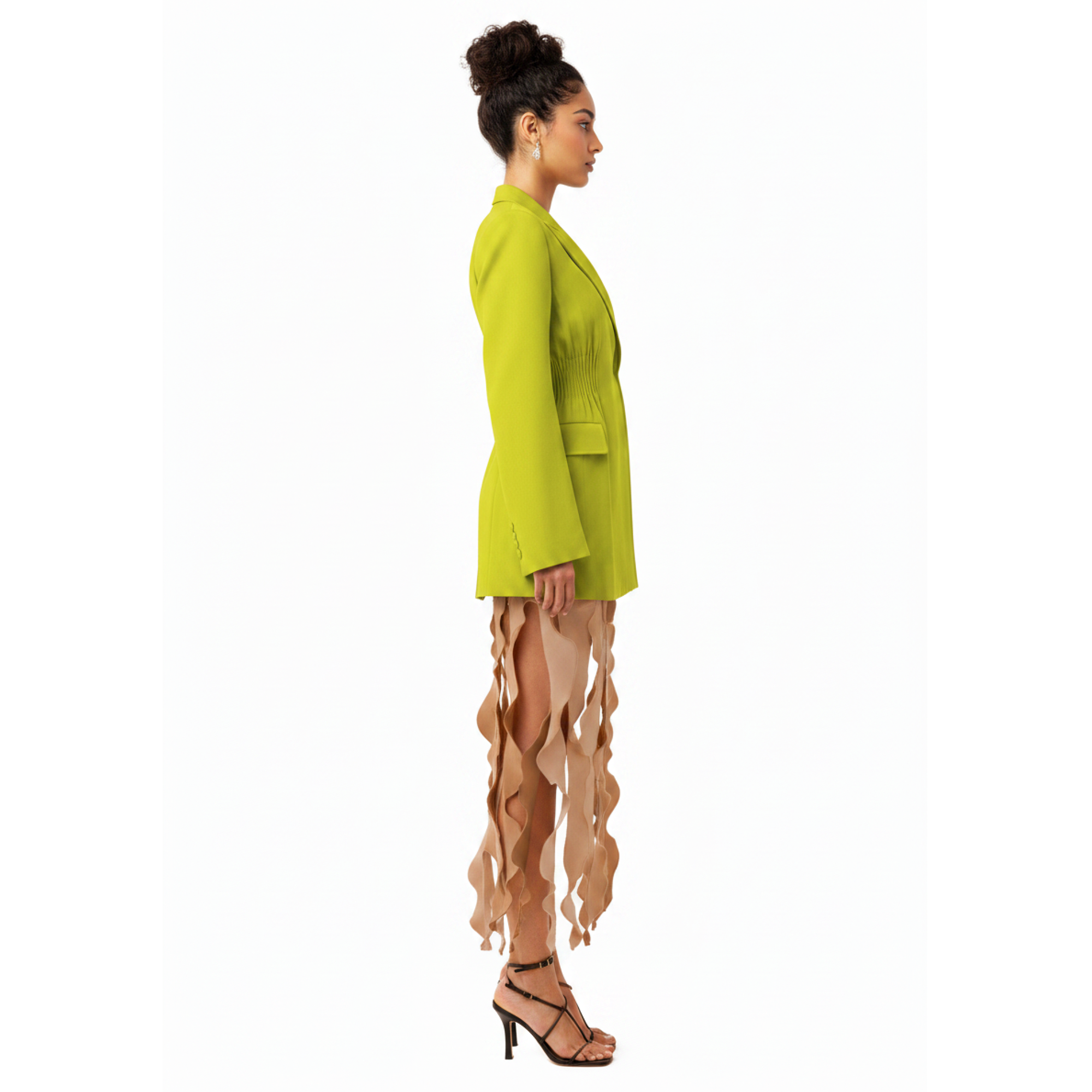 Woman wearing a bright green blazer on a white background