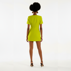 Woman wearing a bright green dress on a white background