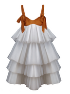 White tiered dress with brown top on a white background