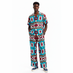 Person wearing a colorful patterned outfit on a white background