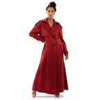 Woman wearing a long red coat on a white background