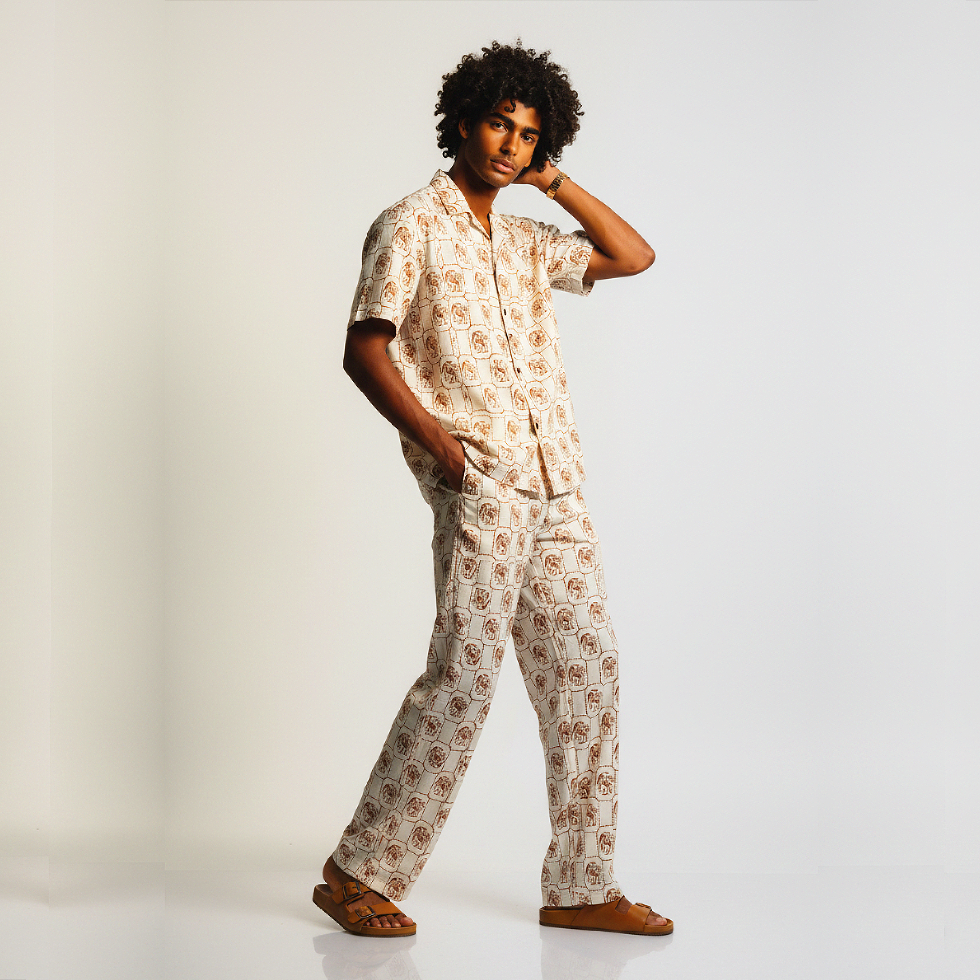 Person wearing a patterned pajama set on a plain background