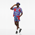 Person wearing a colorful outfit with a matching hat on a white background