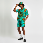 Person wearing a colorful outfit with a matching hat on a white background