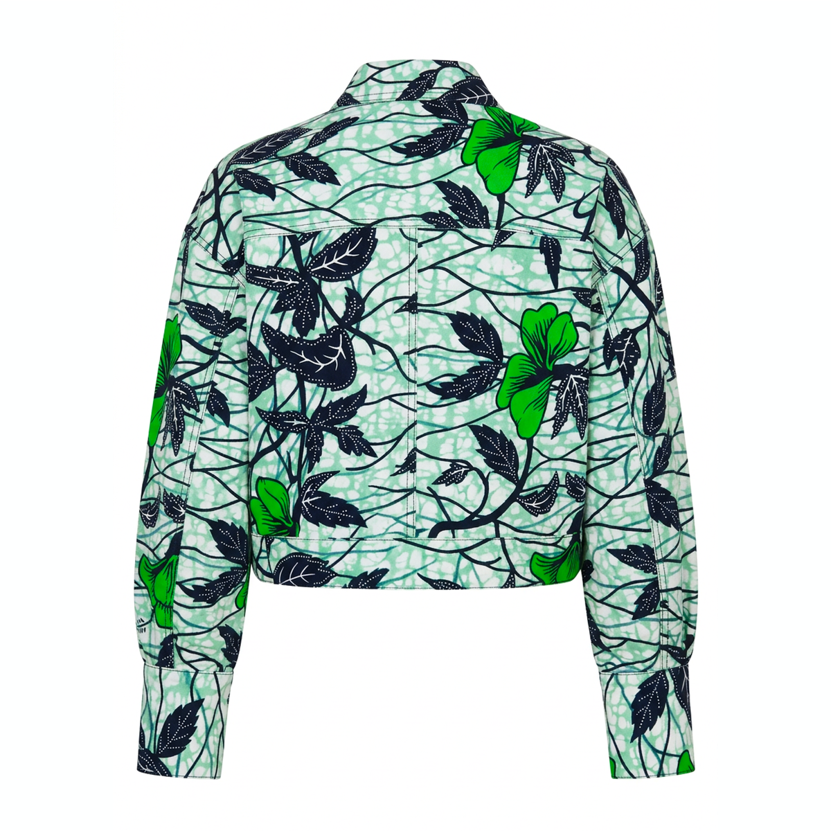 A cropped long-sleeve button-up shirt with a vibrant green and black tropical floral print on a white background, shown from the back.