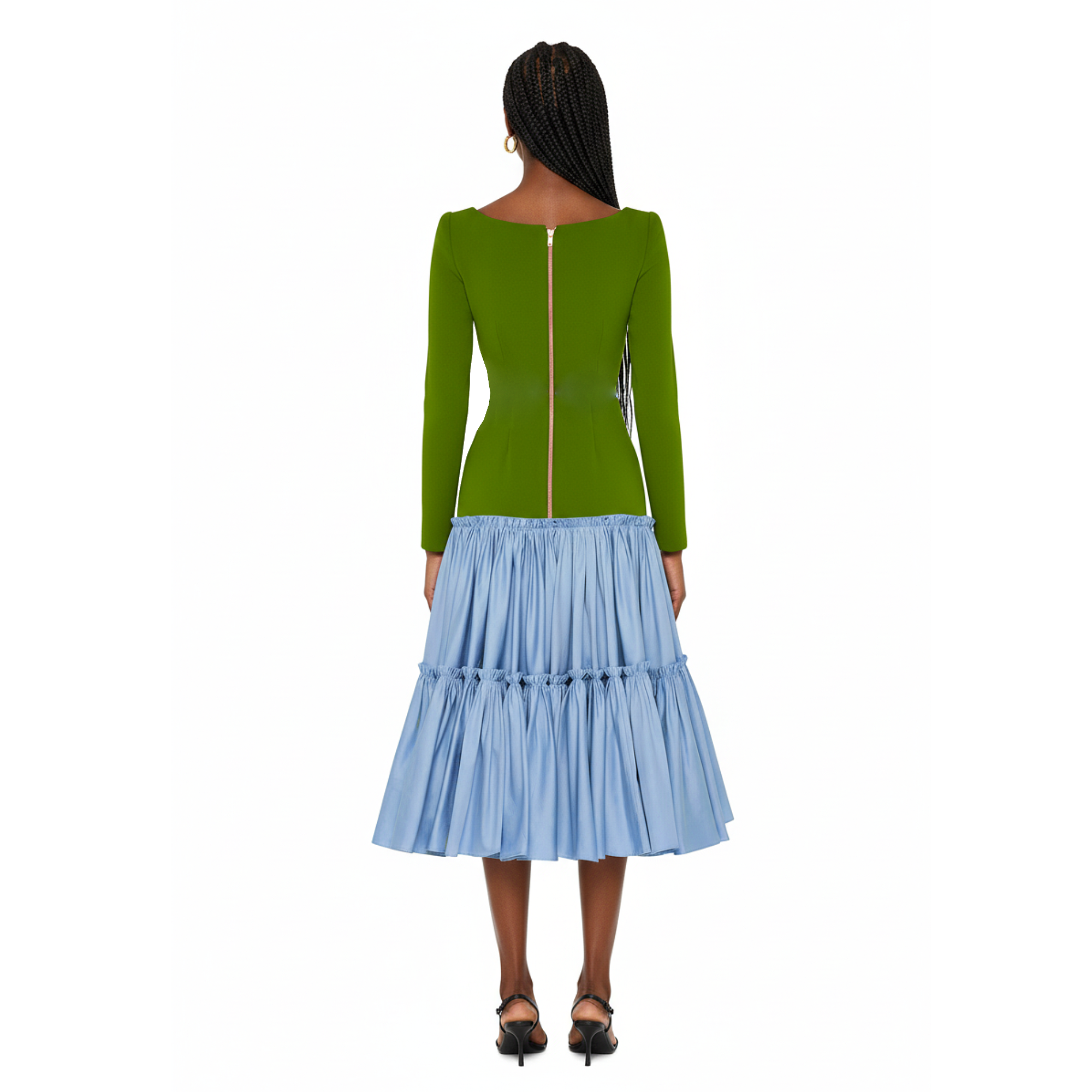 Woman wearing a dress with a green top and blue skirt on a white background