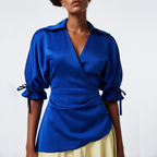 Woman wearing a dress with a  blue top with yellow skirt on a white background