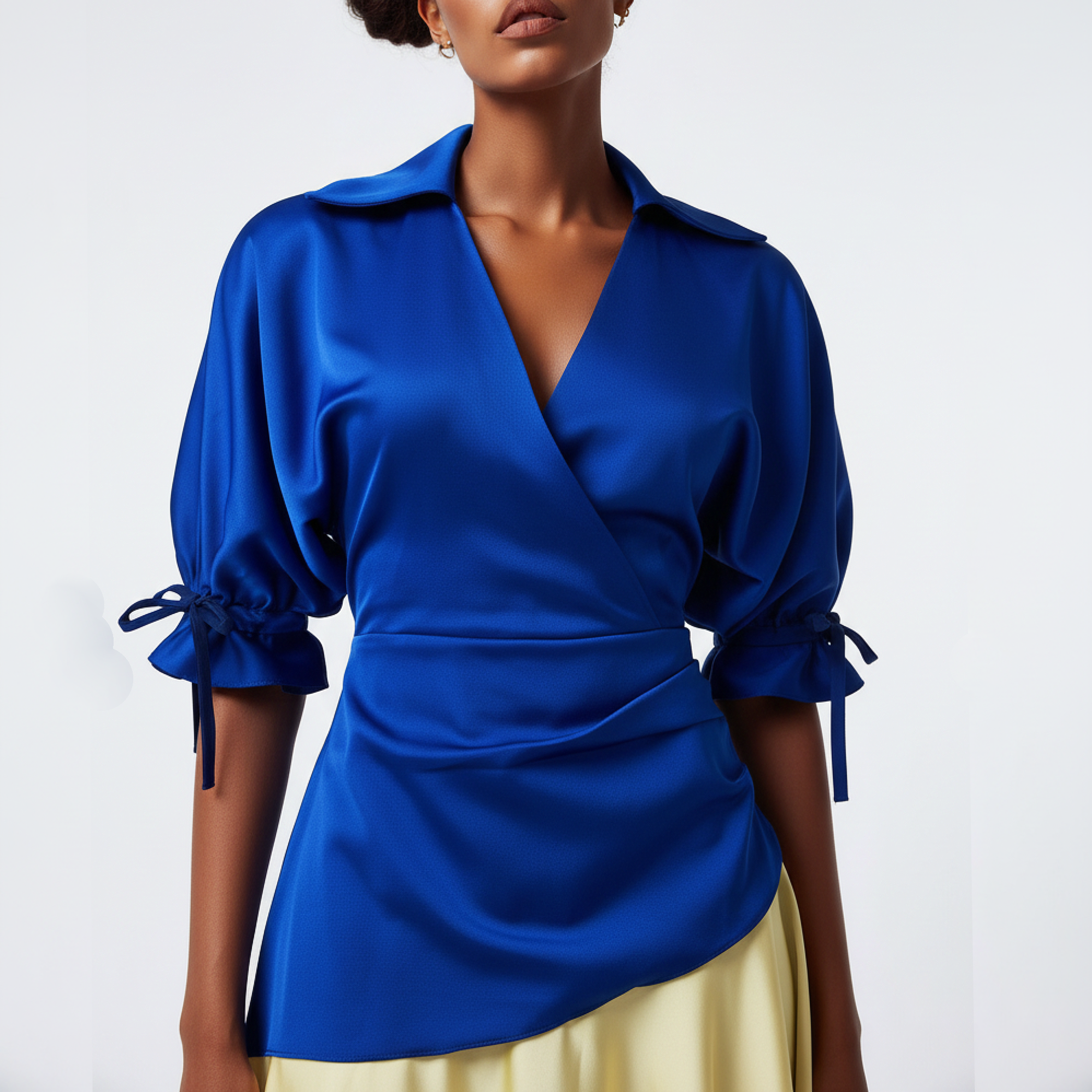 Woman wearing a dress with a  blue top with yellow skirt on a white background