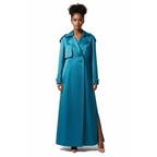 Woman wearing a long blue trench coat on a white background