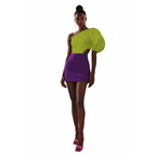 Woman wearing a green and purple dress on a white background