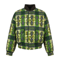 A green and yellow African wax print jacket with a dark brown ribbed mock neck collar, front zipper, and two front patch pockets, shown on a plain white background.