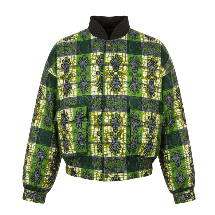 A green and yellow African wax print jacket with a dark brown ribbed mock neck collar, front zipper, and two front patch pockets, shown on a plain white background.