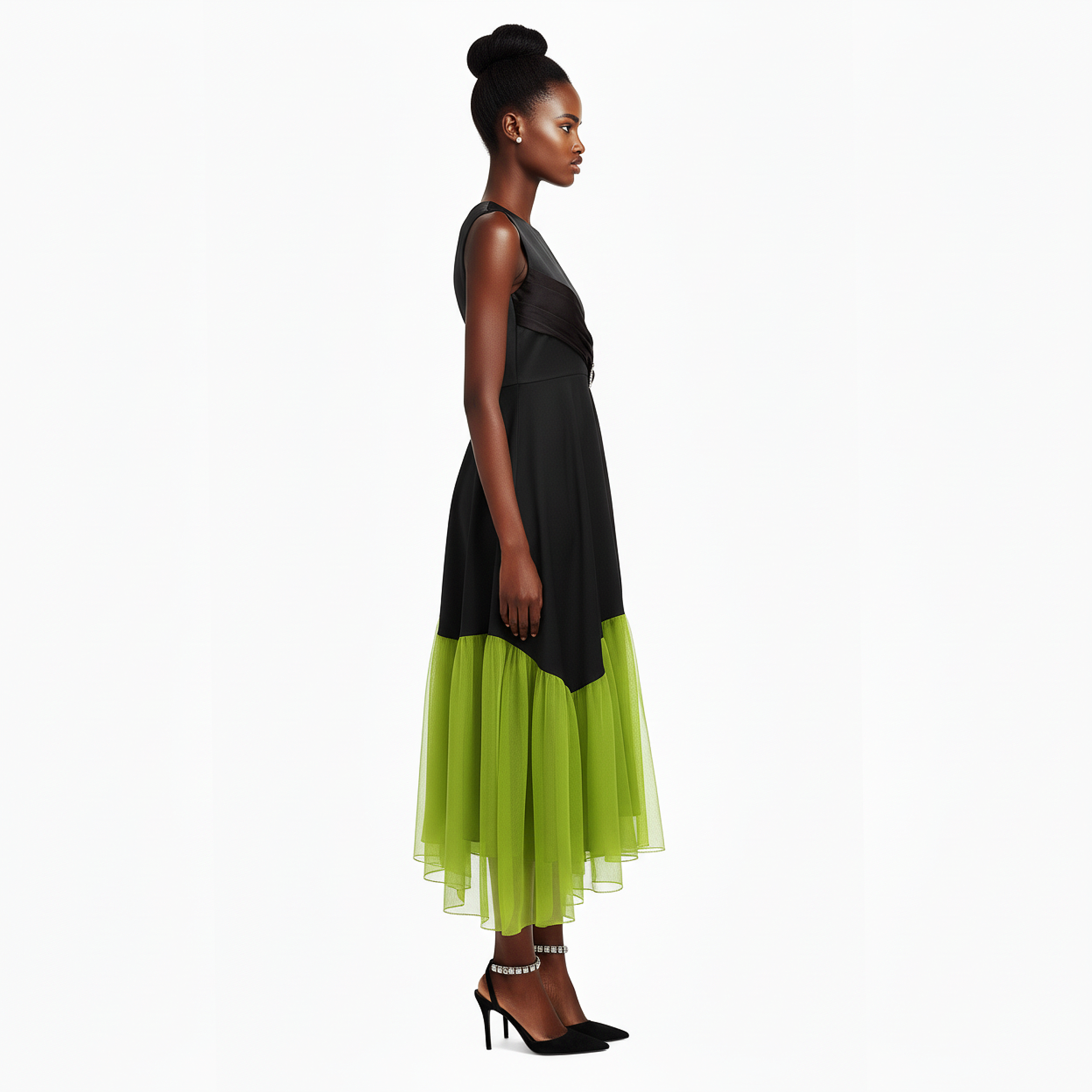 Woman wearing a black and green dress on a white background